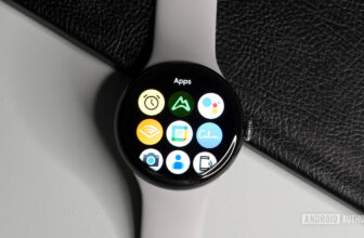 The Samsung Galaxy Watch 4 and Apple Watch Series 6 lying on a table showing the all-apps page.