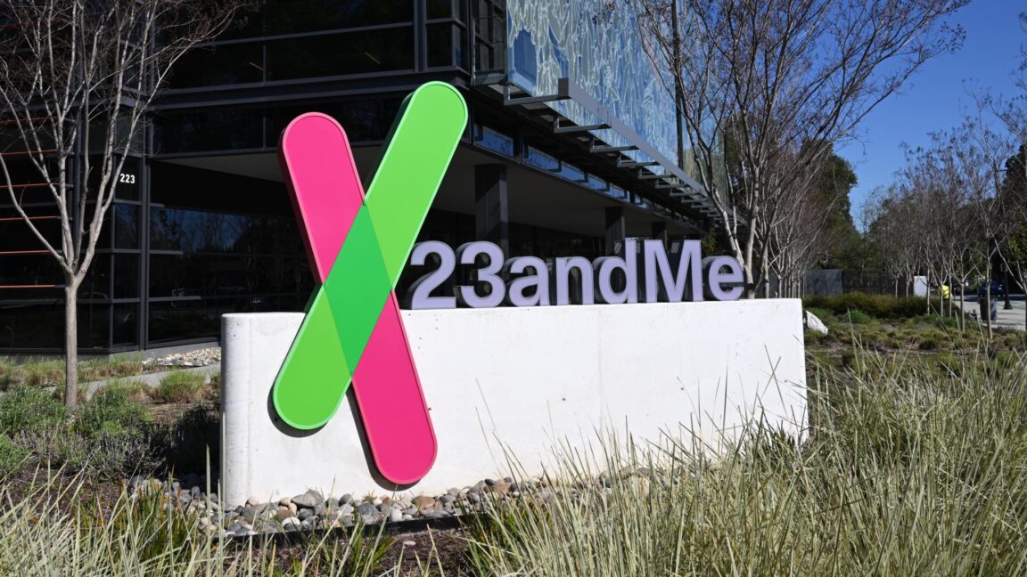 A sign with the 23andMe logo placed in front of a building that serves as the company's headquarters.