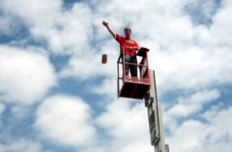 A physics teacher on a lift drops a package designed to protect three eggs from a fall of ten meters