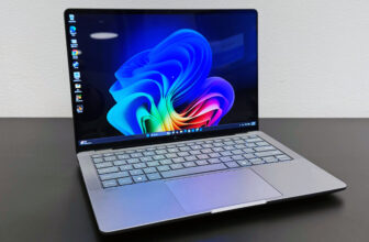 The HP ZBook Ultra 14 G1a mobile workstation open on a black desk against a white wall.