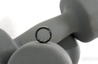 A Samsung Galaxy Ring rests on a set of hand weights.
